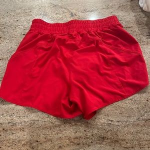 size 12 lululemon track that mid rise lined shorts 5” dark res